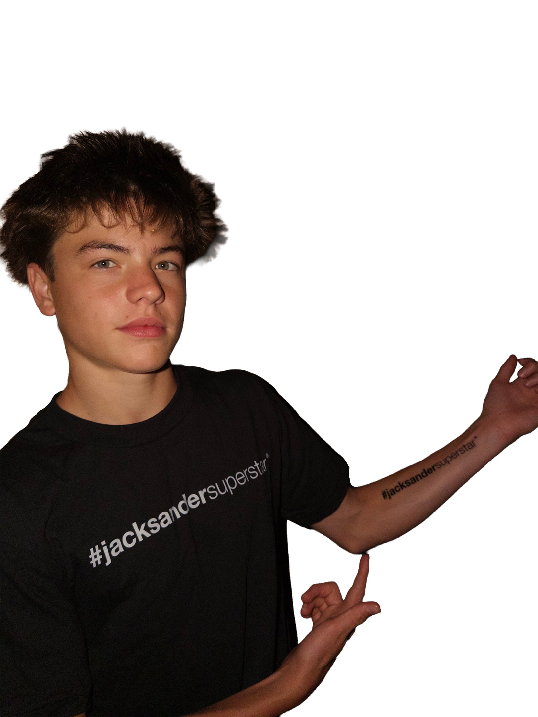 Portrait in a black jacksandersuperstar tee, pointing to the matching forearm lettering.
